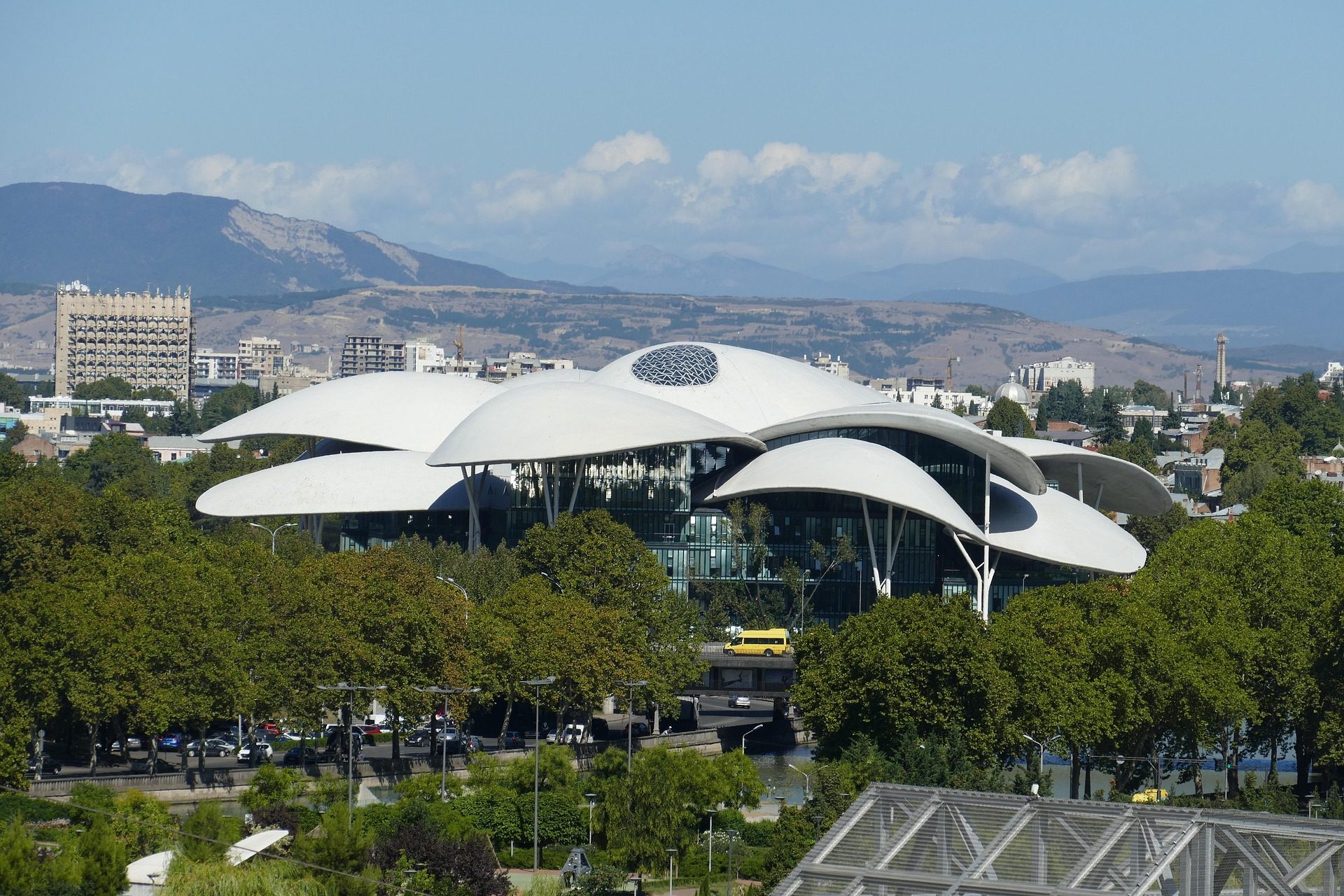 The Public Service Hall in Tbilisi, with the city and mountains behind